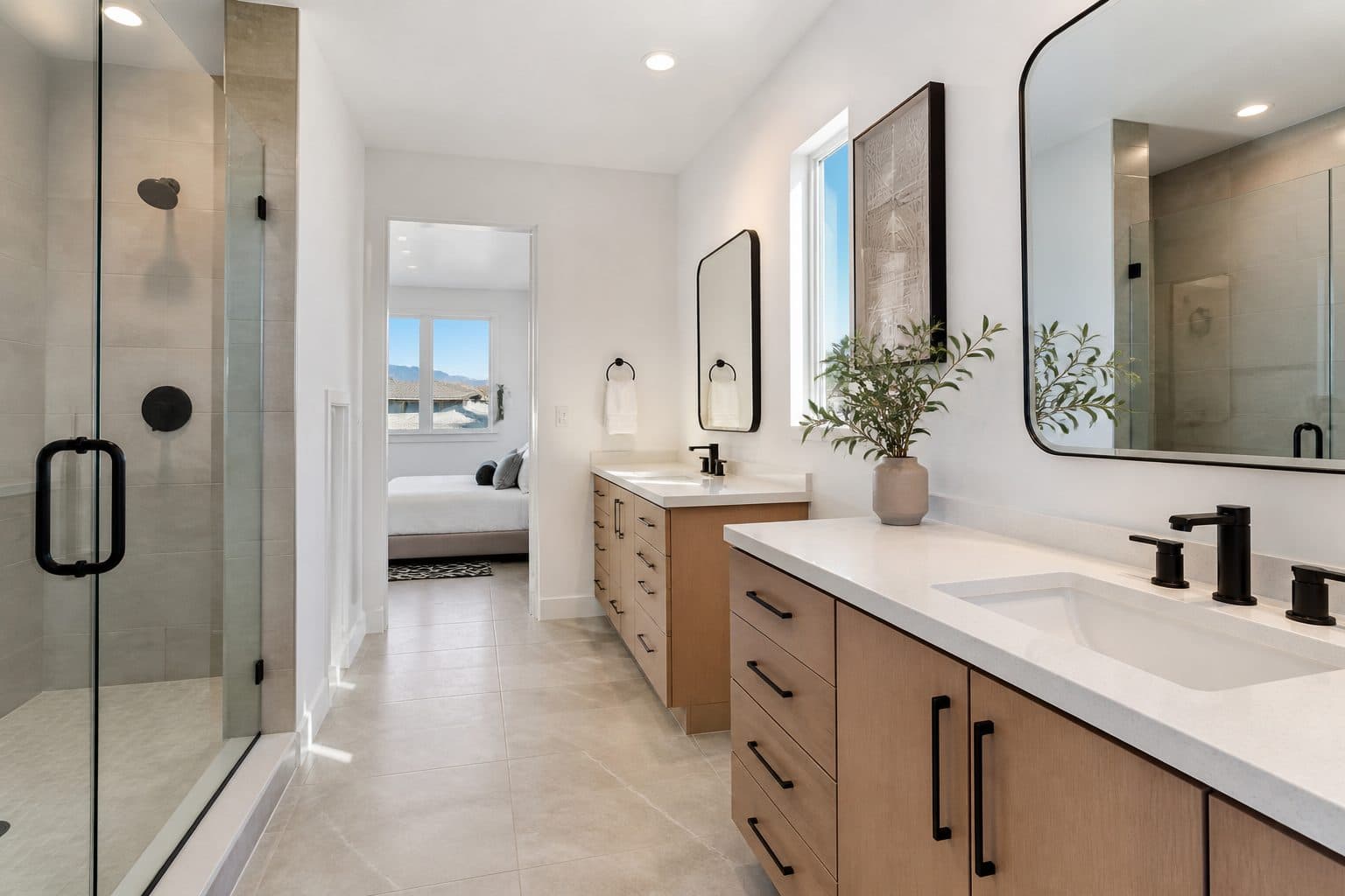 Primary bath with dual vanities and walk-in shower in Henderson